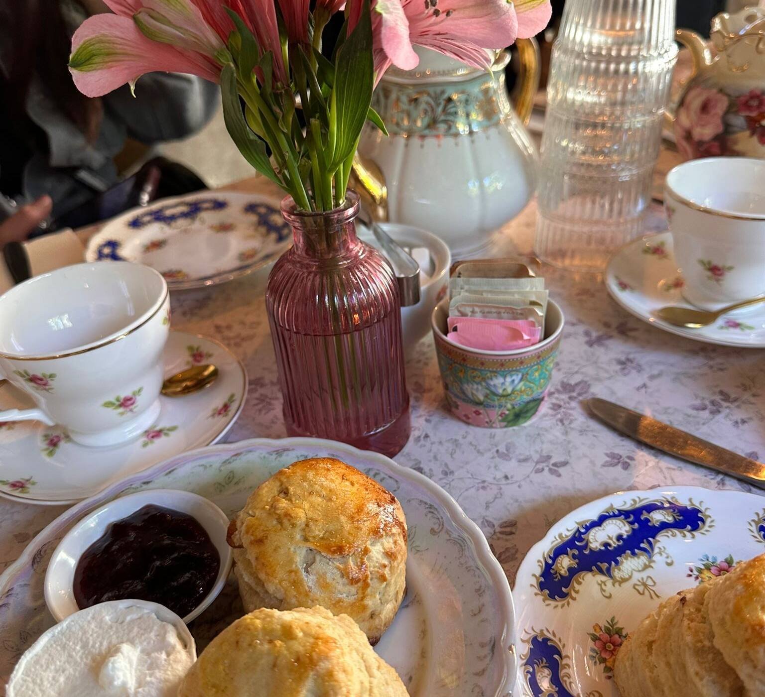 Scones, jam and tea served on vintage china at Kumkum Tea House in Baka