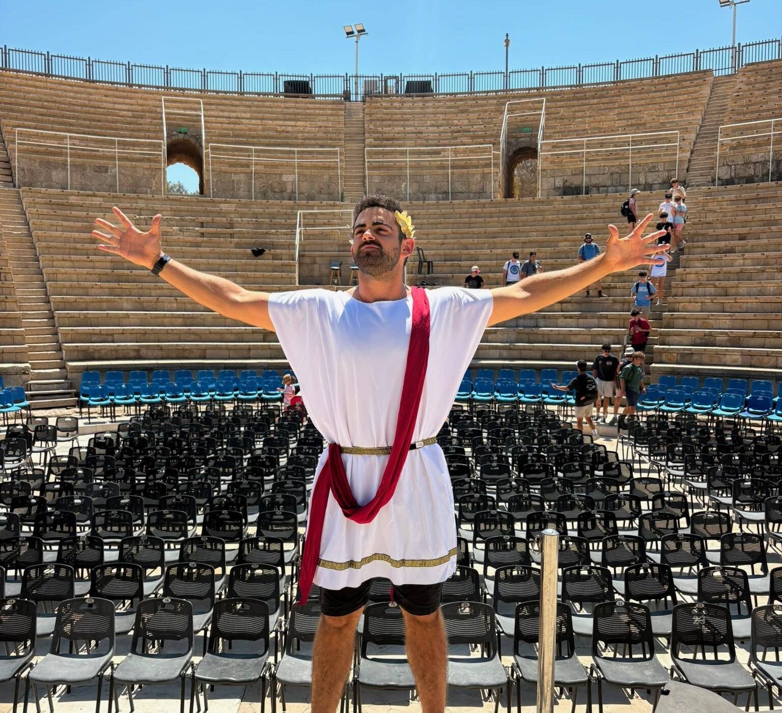 Yona Shemesh in Roman dress at the theatre in Caesarea