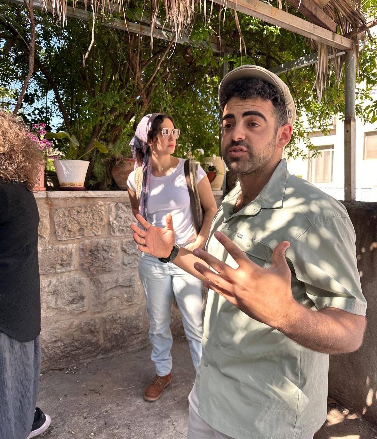 Yona Shemesh guiding in a Jerusalem neighborhood outside the Old City walls