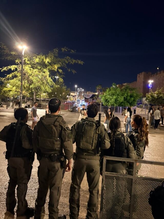 Soldiers posing for a photo from behind at Jaffa Gate Jerusalem