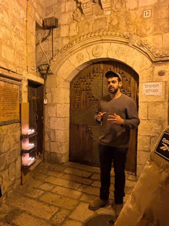 Yona Shemesh guiding in an Old City alley after dark