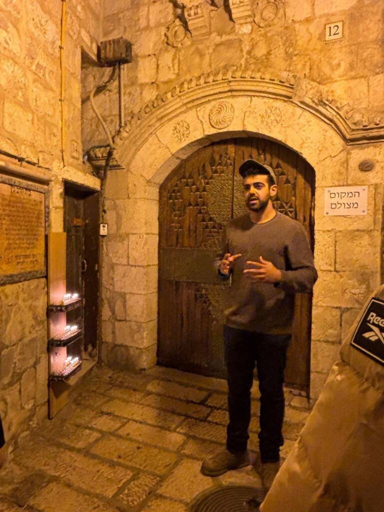 Yona Shemesh guiding in an Old City alley after dark
