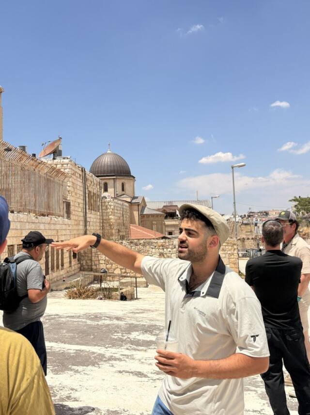 Yona Shemesh pointing out a site on the rooftops of the Old City