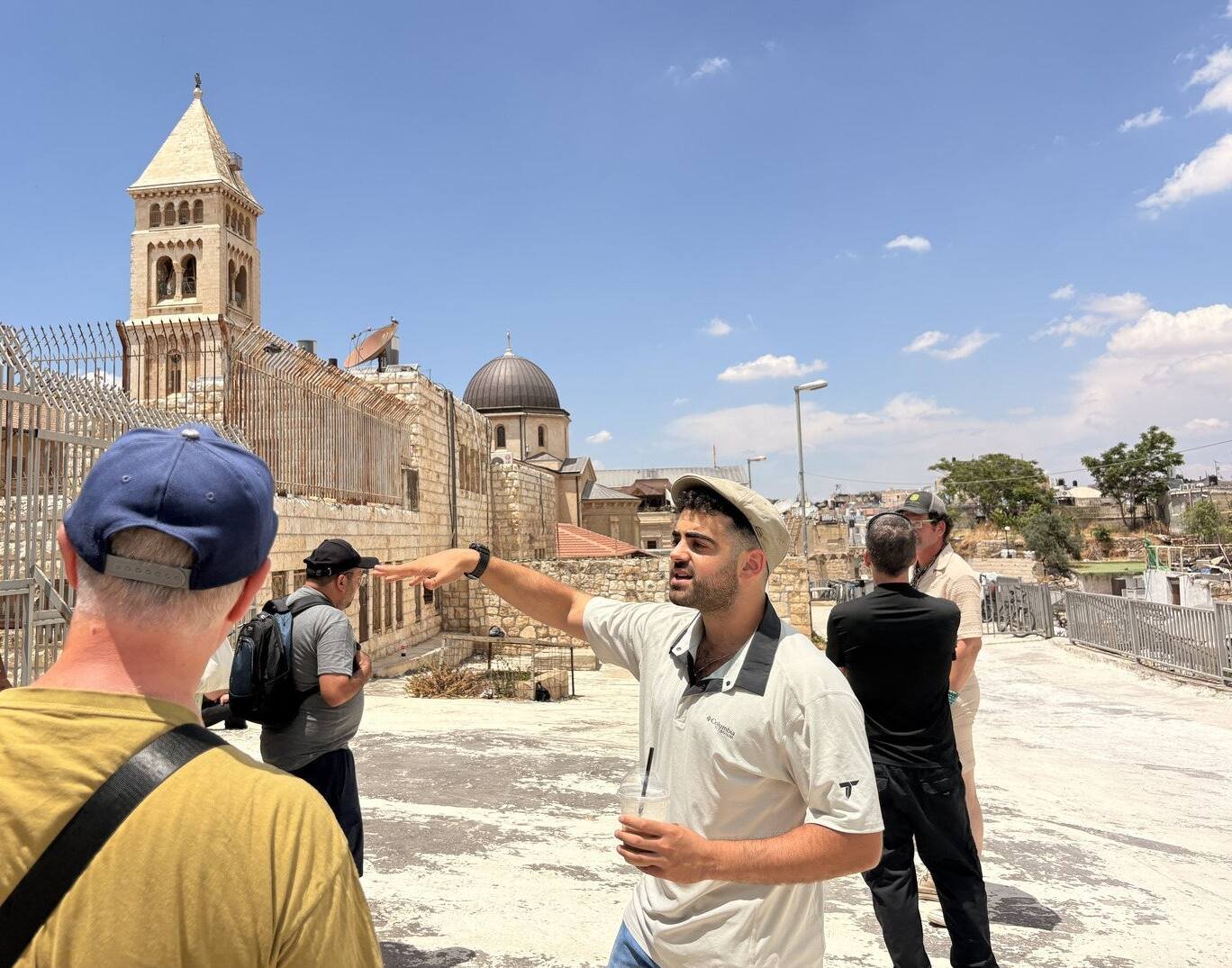 Yona Shemesh pointing out a site on the rooftops of the Old City