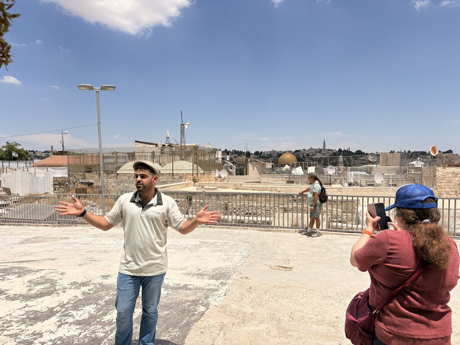 Yona Shemesh on an Old City rooftop with the Dome of the Rock behind him