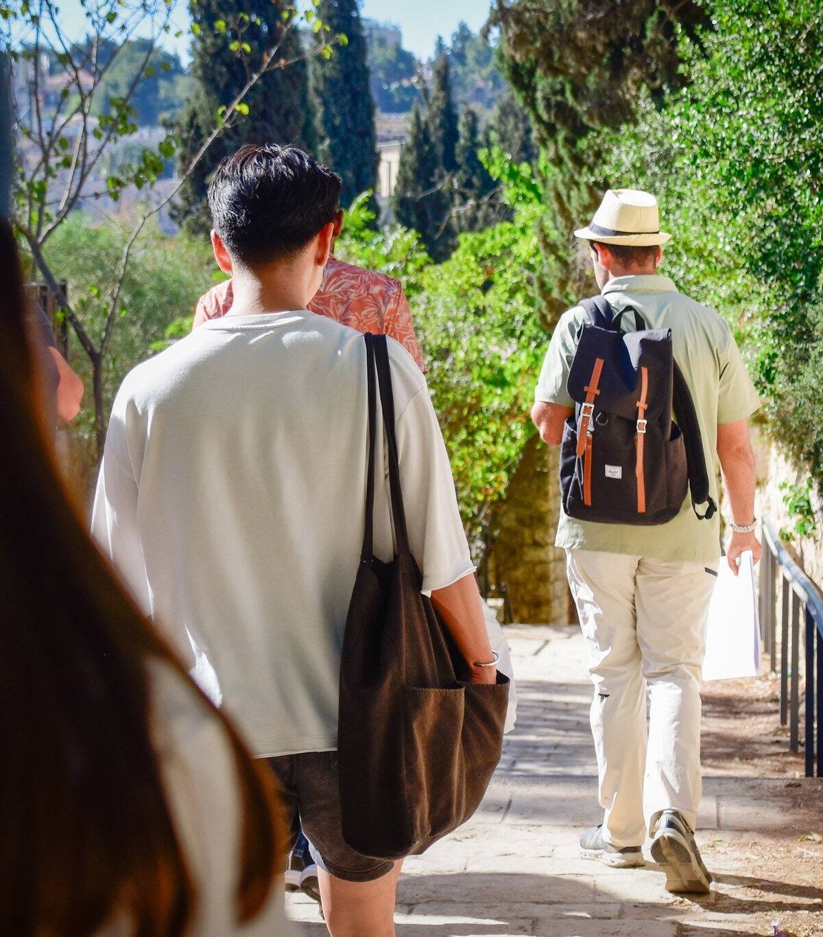 Guests walking a quiet Jerusalem lane on a private tour