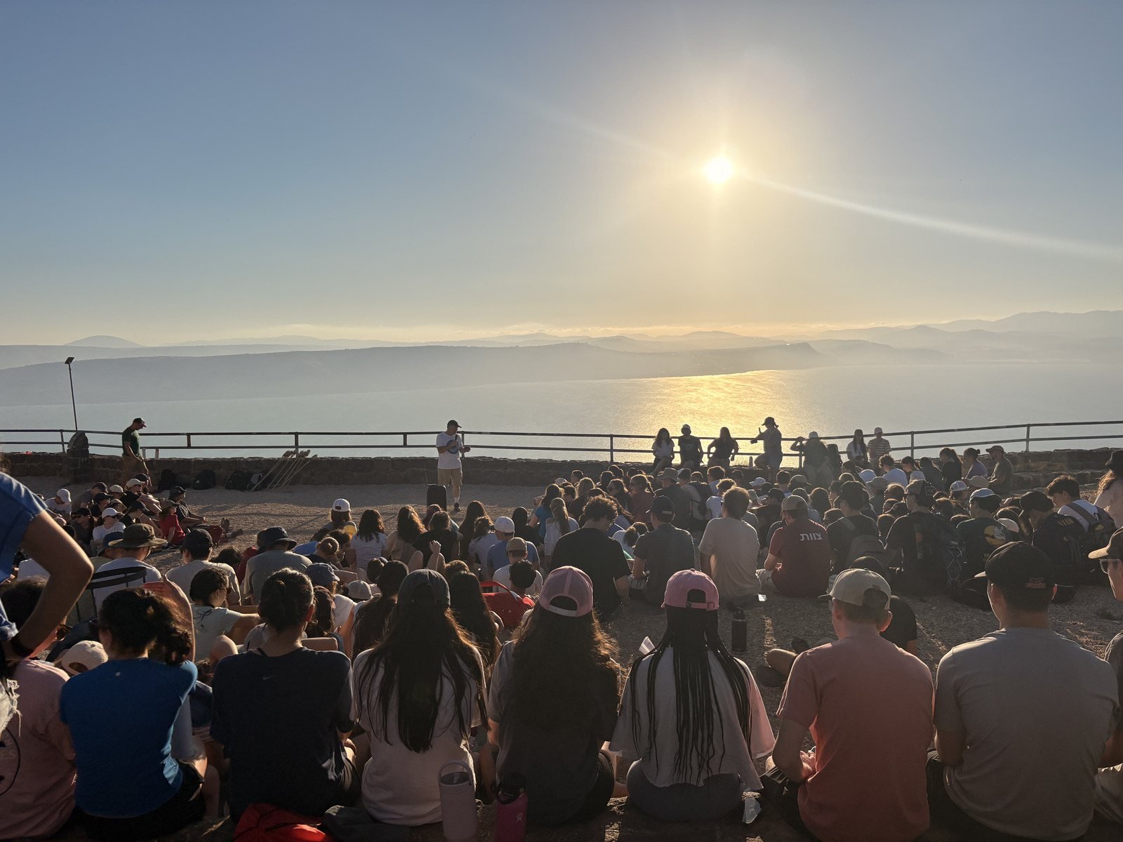 A group gathered above the Sea of Galilee at sunset
