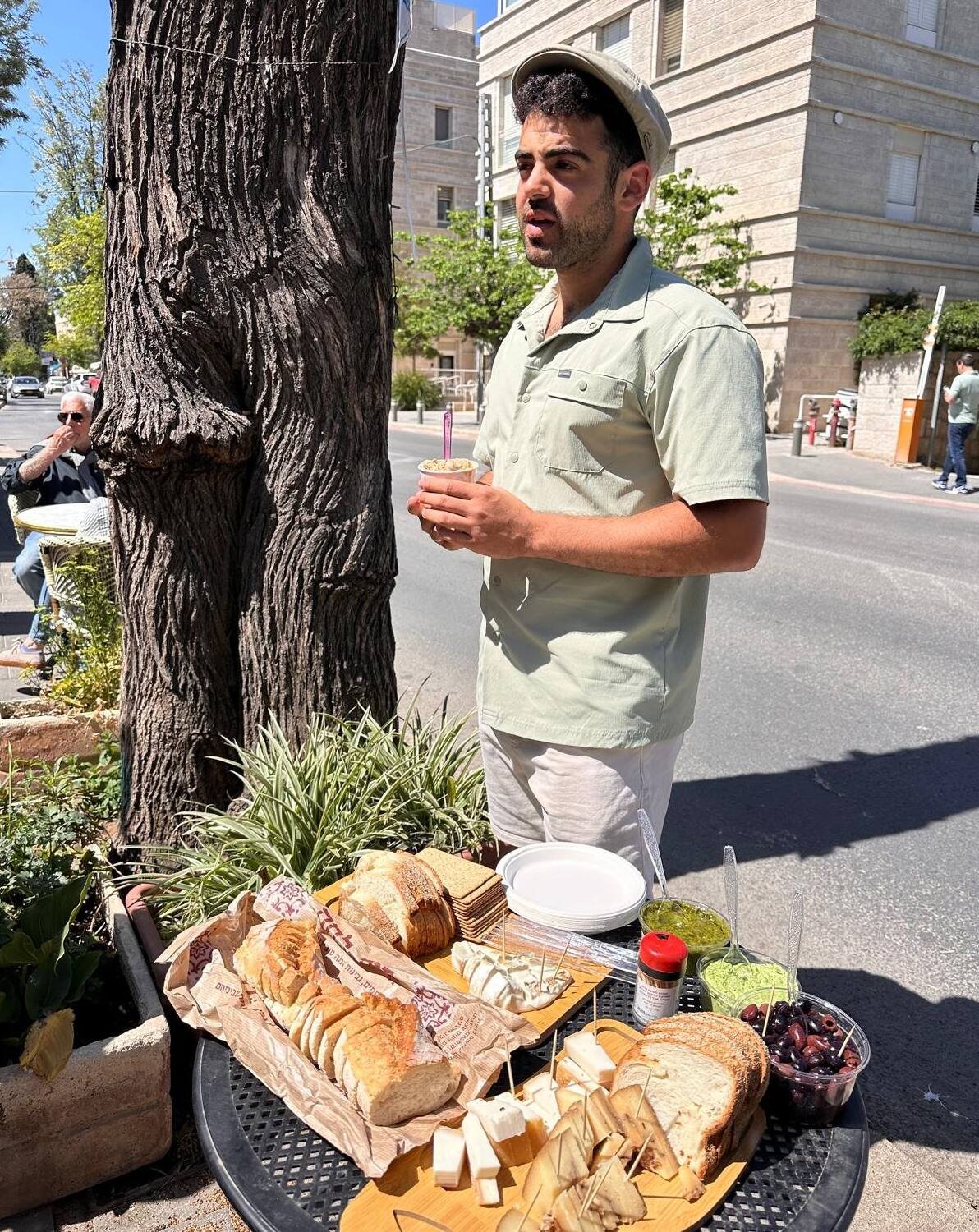 Bread, cheeses and dips laid out at a tasting stop on a Jerusalem food tour
